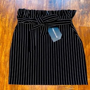 Striped mini skirt with pleated waist.